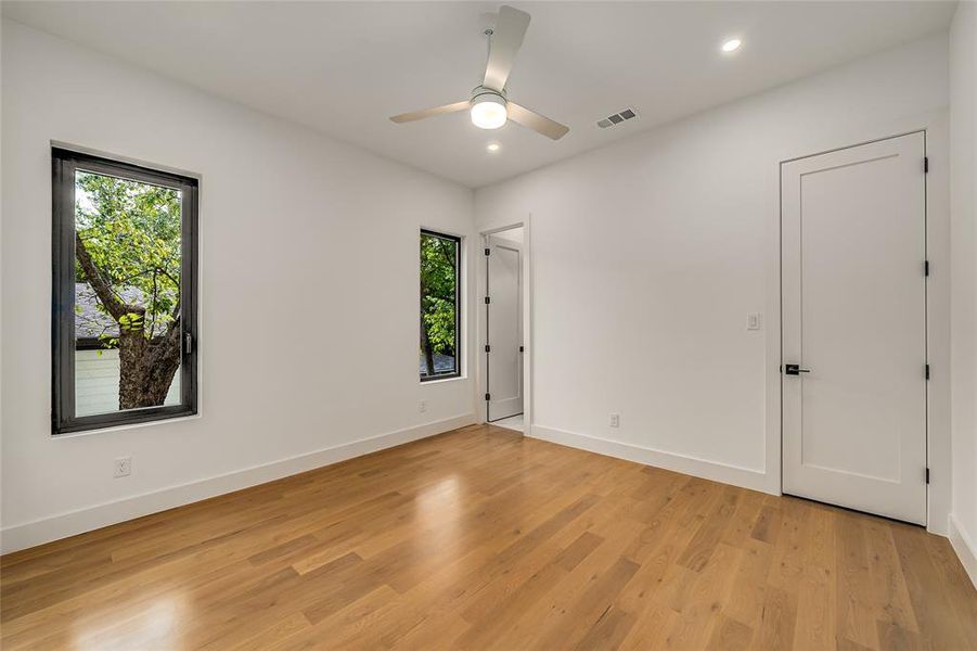 Unfurnished room with light wood-style floors, recessed lighting, and a ceiling fan Unfurnished room with light wood-style floors, recessed lighting, and a ceiling fan