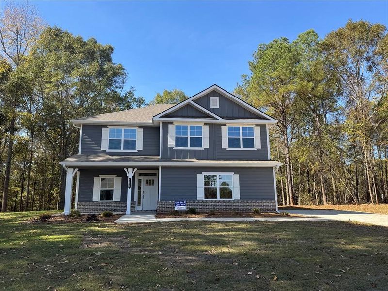Front exterior of a new home in The Fields of Walnut Creek, Pendergrass, GA, highlighting curb appeal (Image 11).