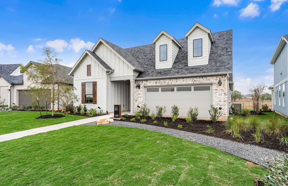 Representative exterior photo of a completed home built from the Prestige by Del Webb in Del Webb Austin at Lost Pines, Bastrop, TX (Image 28).