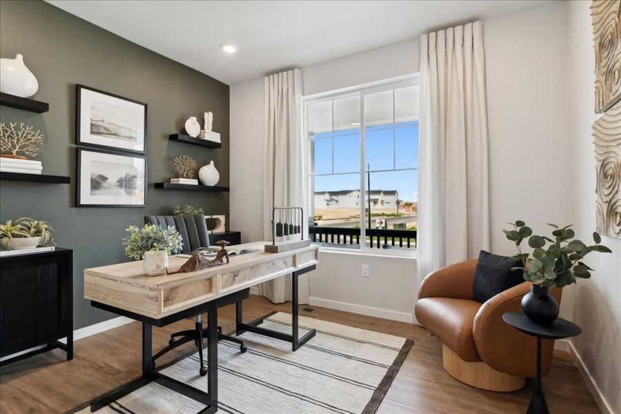 A living room with a table and chairs. A living room with a table and chairs.