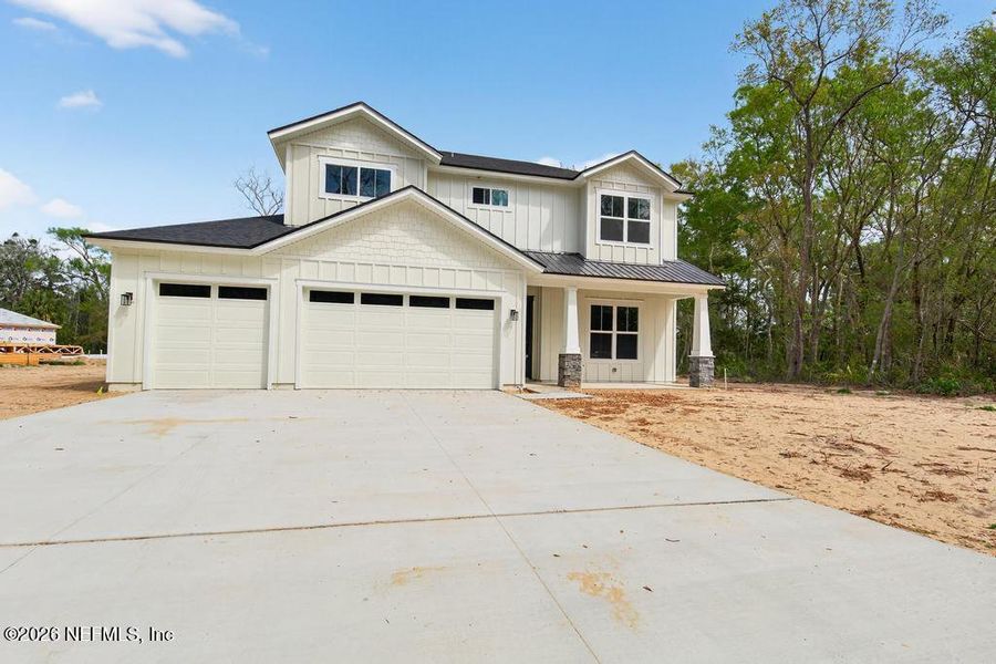 Front exterior of a new home in , Yulee, FL, highlighting curb appeal (Image 33). Front exterior of a new home in , Yulee, FL, highlighting curb appeal (Image 33).