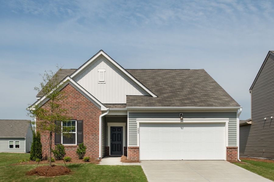 Front exterior of a new home in Crescent Mills, Wilson's Mills, NC, highlighting curb appeal (Image 1). Front exterior of a new home in Crescent Mills, Wilson's Mills, NC, highlighting curb appeal (Image 1).
