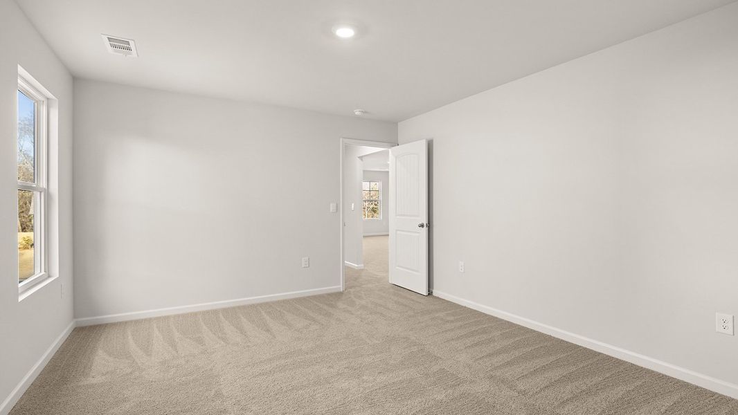 Representative unfurnished interior of a home built from the Mansfield by D.R. Horton in Liberty Crossing, Braselton (Image 29).