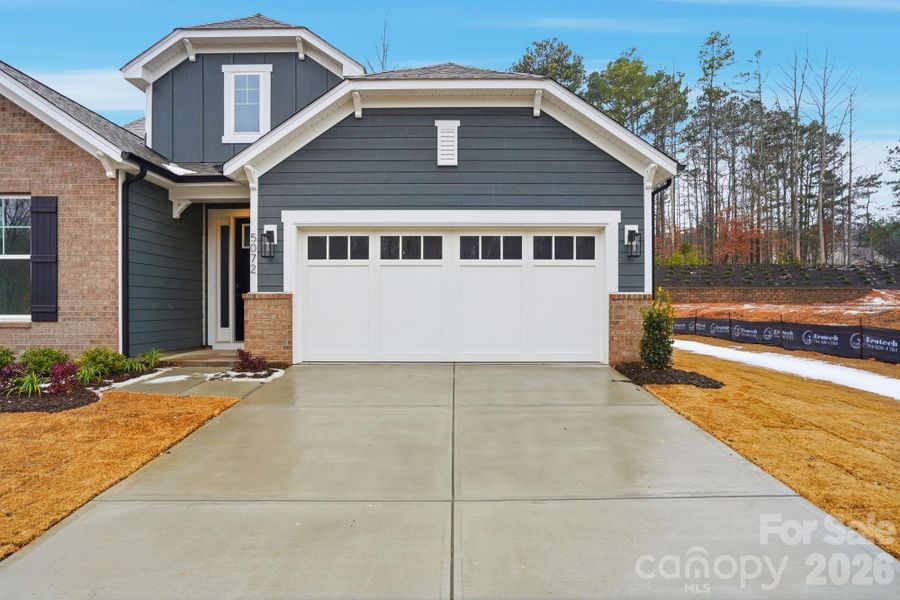 Front exterior of a new home in Rone Creek, Waxhaw, NC, highlighting curb appeal (Image 2). Front exterior of a new home in Rone Creek, Waxhaw, NC, highlighting curb appeal (Image 2).