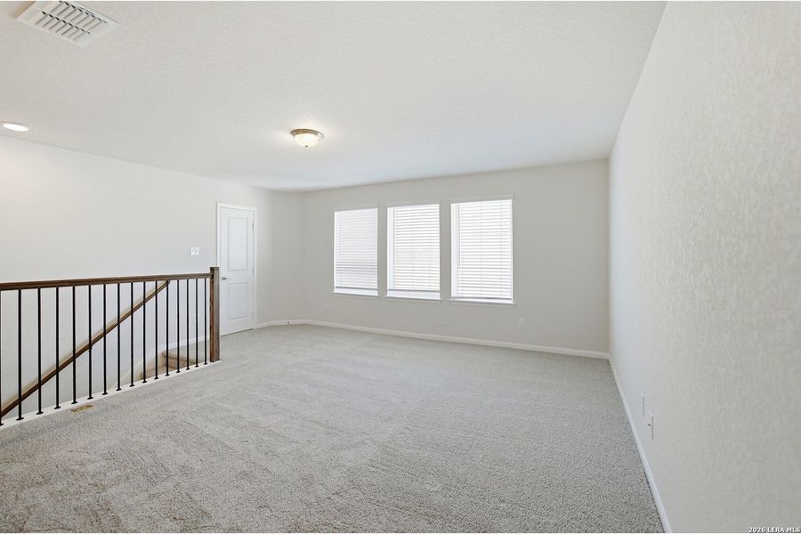 Spacious, unfurnished interior of a new home in The Woodlands at Medina Hills, Mico (Image 25).