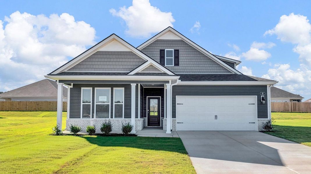 Front exterior of a new home in The Orchard, Millington, TN, highlighting curb appeal (Image 2).