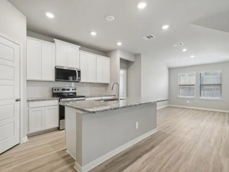 Kitchen in the Briscoe floorplan at a Meritage Homes community. Kitchen in the Briscoe floorplan at a Meritage Homes community.