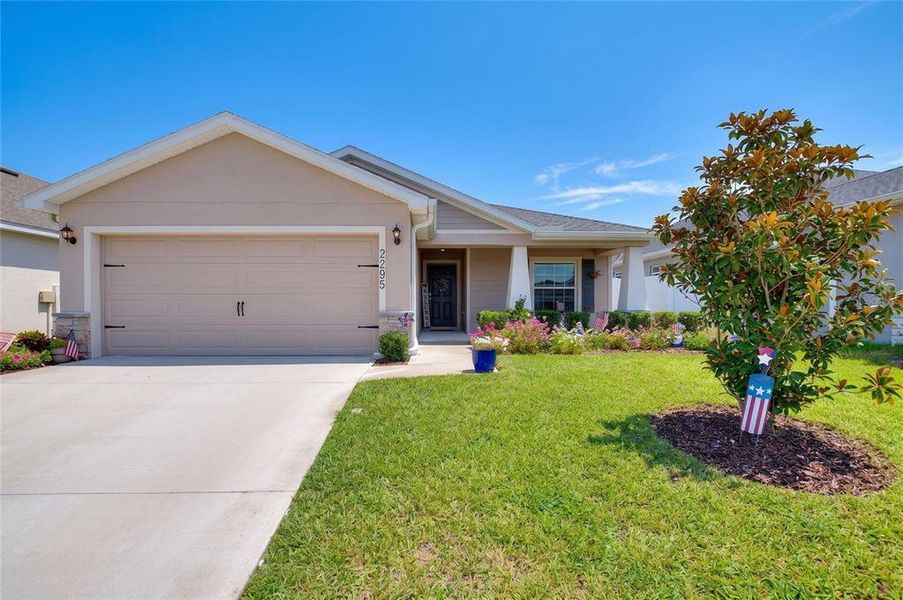 Front exterior of a new home in , Davenport, FL, highlighting curb appeal (Image 2). Front exterior of a new home in , Davenport, FL, highlighting curb appeal (Image 2).