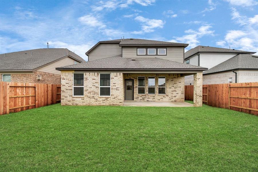 Explore the expansive backyard with its inviting covered patio—a perfect blend of space for the kids to play and adults to unwind.