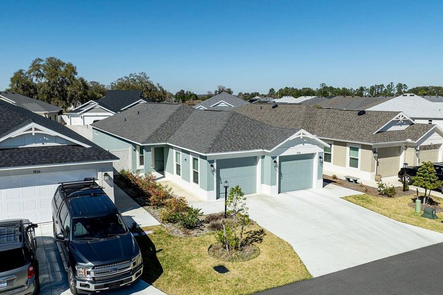 Front exterior of a new home in , The Villages, FL, highlighting curb appeal (Image 21).