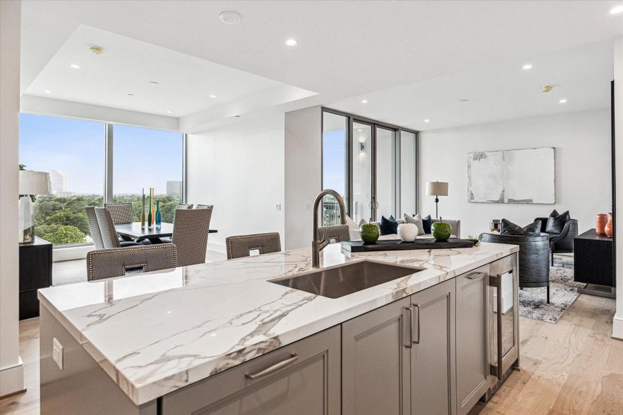 This designer kitchen effortlessly blends style and function. Gorgeous porcelain counter-top and storage galore. Photos are of a similar unit with the same floor plan