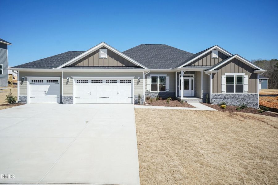 Front exterior of a new home in Kelly Farms, Lillington, NC, highlighting curb appeal (Image 1). Front exterior of a new home in Kelly Farms, Lillington, NC, highlighting curb appeal (Image 1).