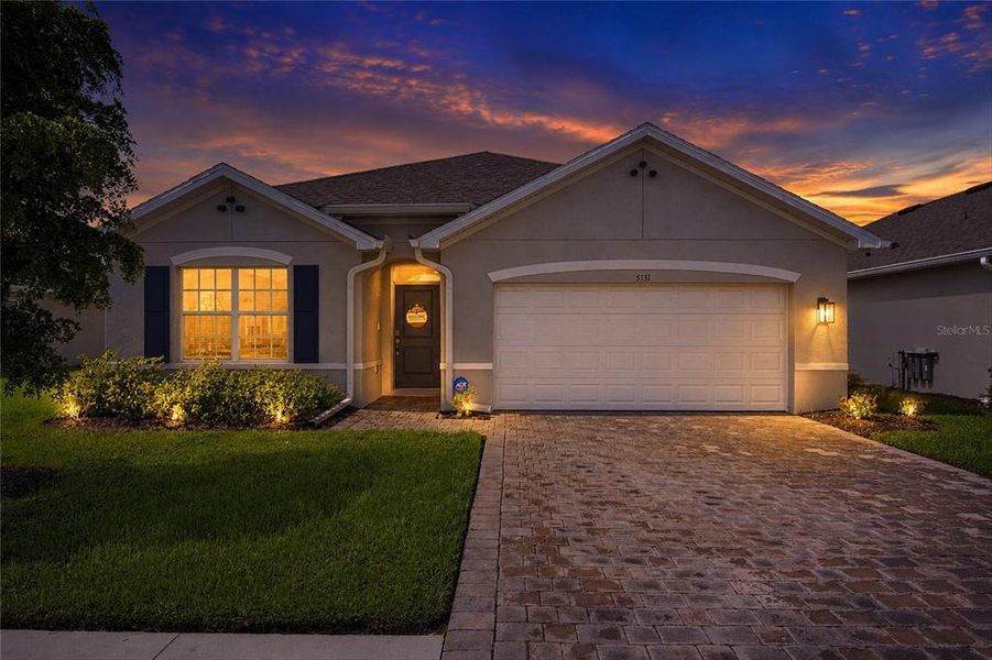 Front exterior of a new home in Central Parc, North Port, FL, highlighting curb appeal (Image 2). Front exterior of a new home in Central Parc, North Port, FL, highlighting curb appeal (Image 2).