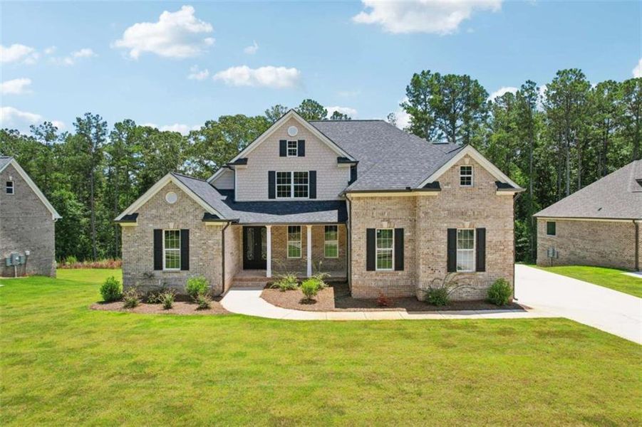 Front exterior of a new home in Whitestone, Douglasville, GA, highlighting curb appeal (Image 2).