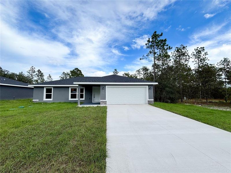 Front exterior of a new home in , Dunnellon, FL, highlighting curb appeal (Image 1). Front exterior of a new home in , Dunnellon, FL, highlighting curb appeal (Image 1).