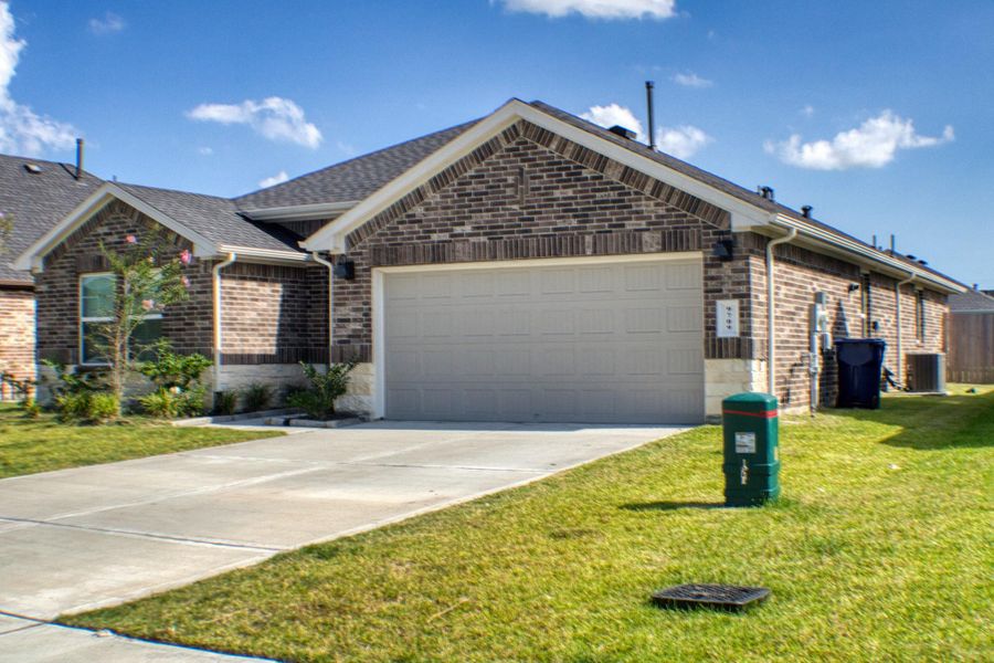 Front exterior of a new home in Central Park, Texas City, TX, highlighting curb appeal (Image 1). Front exterior of a new home in Central Park, Texas City, TX, highlighting curb appeal (Image 1).
