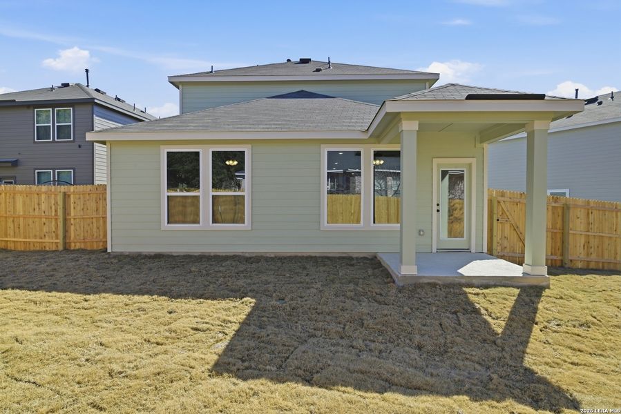 Exterior details and patio area of a home in Fairway Crossing, Converse (Image 16).