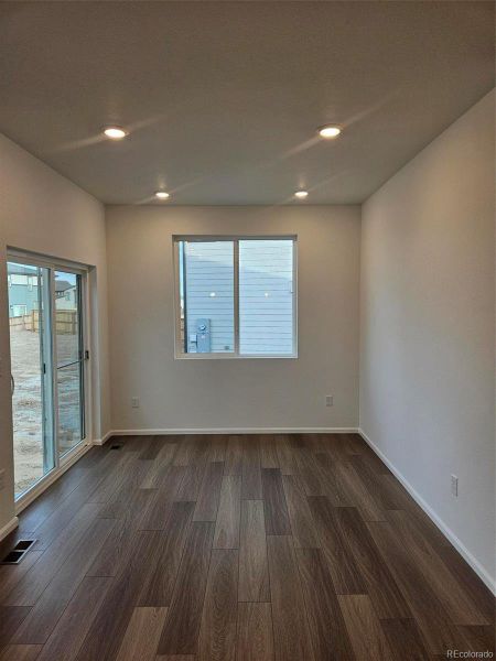 Spacious, unfurnished interior of a new home in The Cottages Collection at Ridgeline Vista, Brighton (Image 10).