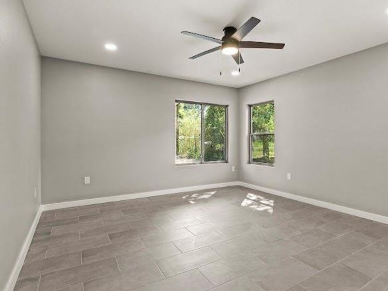 Unfurnished room with recessed lighting and a ceiling fan