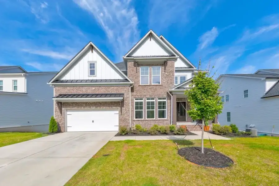 Front exterior of a new home in , Woodstock, GA, highlighting curb appeal (Image 29).