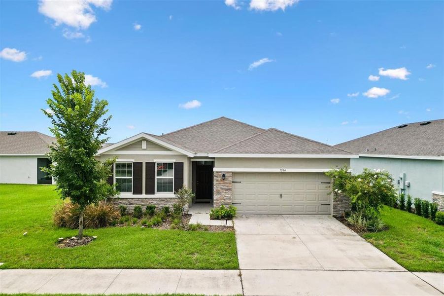 Front exterior of a new home in Beaumont, Wildwood, FL, highlighting curb appeal (Image 15).