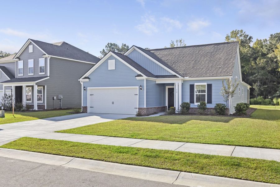Front exterior of a new home in Cedar Glen Preserve, Huger, SC, highlighting curb appeal (Image 1).