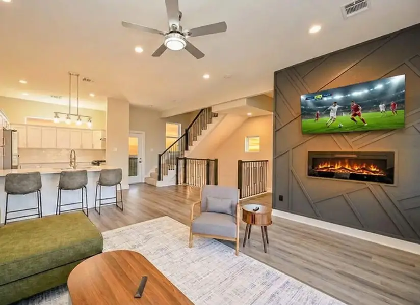 Spacious main living area with high ceilings and seamless flow to the open kitchen for sharing life with family and friends.
