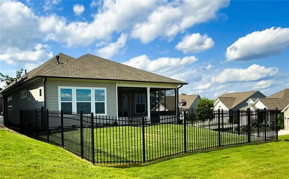 Exterior details and patio area of a home in The Retreat at Sterling on the Lake 48', Flowery Branch (Image 22).