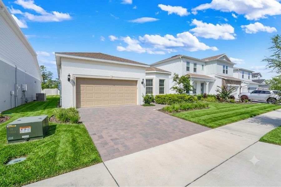 Front exterior of a new home in , Orlando, FL, highlighting curb appeal (Image 2). Front exterior of a new home in , Orlando, FL, highlighting curb appeal (Image 2).