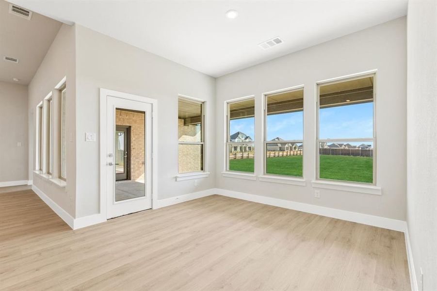 Spare room featuring carpet flooring and baseboards Spare room featuring carpet flooring and baseboards