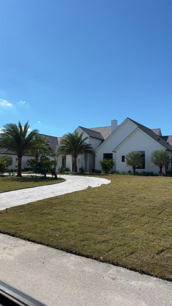 Front exterior of a new home in , Wellington, FL, highlighting curb appeal (Image 2).