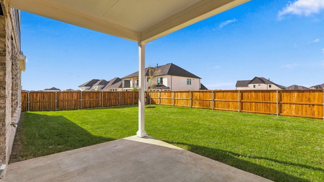 Exterior details and patio area of a home in Green Meadows Classic, Celina (Image 29).