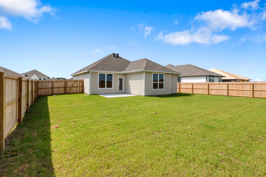 Front exterior of a new home in , Snook, TX, highlighting curb appeal (Image 1). Front exterior of a new home in , Snook, TX, highlighting curb appeal (Image 1).