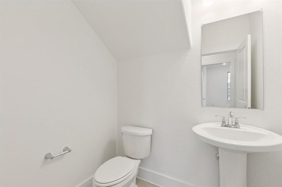 Bathroom with toilet and baseboards Bathroom with toilet and baseboards