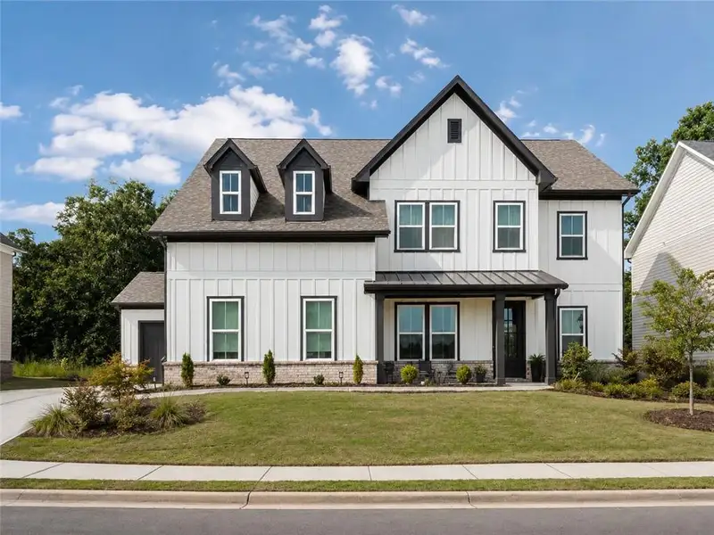 Front exterior of a new home in , Duluth, GA, highlighting curb appeal (Image 24). Front exterior of a new home in , Duluth, GA, highlighting curb appeal (Image 24).