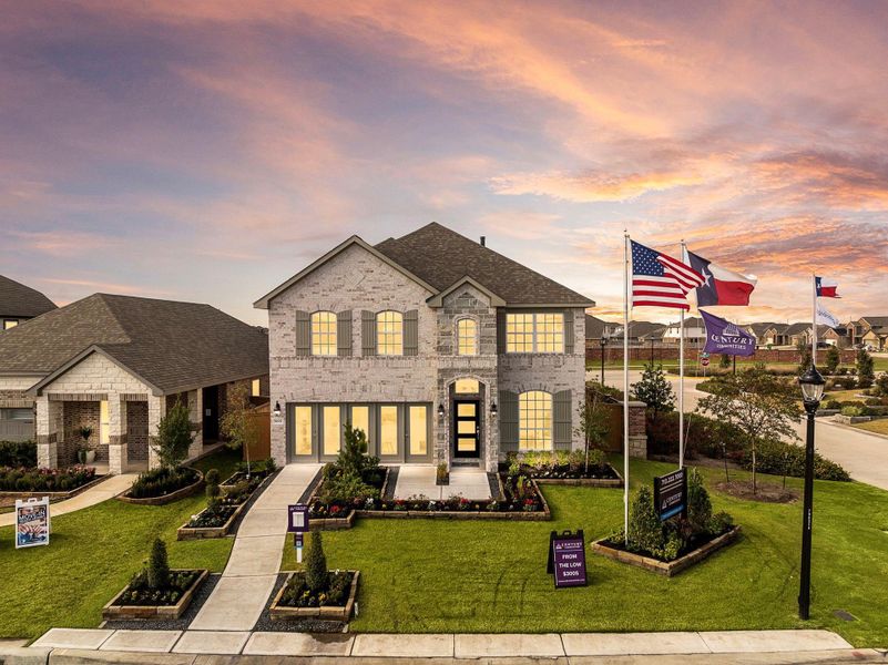 Front exterior of a new home in Sunterra, Katy, TX, highlighting curb appeal (Image 1). Front exterior of a new home in Sunterra, Katy, TX, highlighting curb appeal (Image 1).