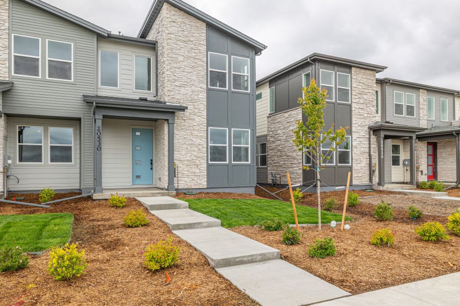 Front exterior of a new home in Painted Prairie, Aurora, CO, highlighting curb appeal (Image 21).