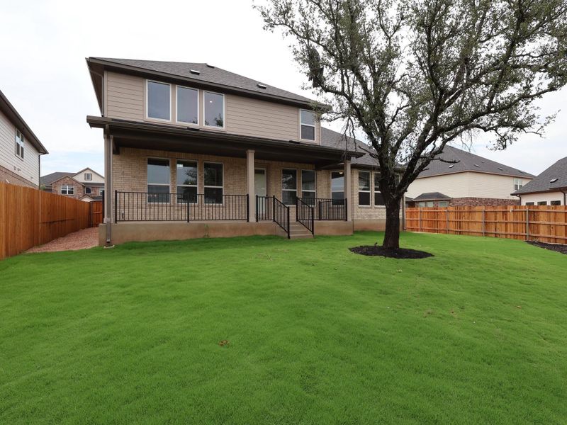 Front exterior of a new home in Edgewood, Leander, TX, highlighting curb appeal (Image 19). Front exterior of a new home in Edgewood, Leander, TX, highlighting curb appeal (Image 19).