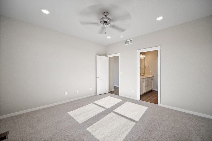 Spacious, unfurnished interior of a new home in The Glen, Colorado Springs (Image 29).