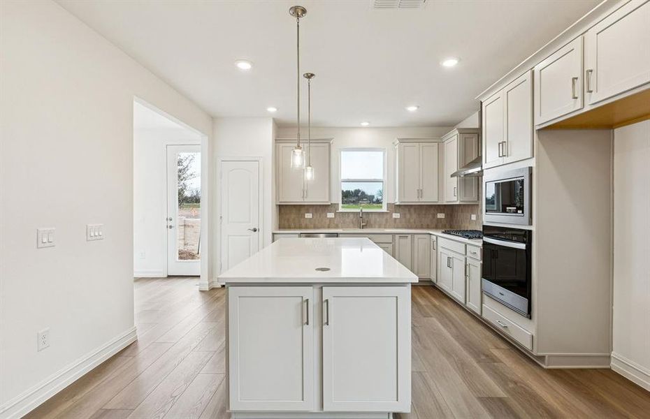 Kitchen open to the sunroom