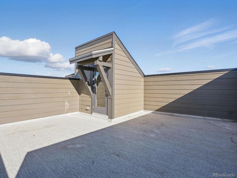 Front exterior of a new home in Three Hills, Morrison, CO, highlighting curb appeal (Image 19).