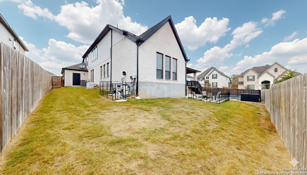 Exterior details and patio area of a home in Weston Oaks 55', San Antonio (Image 23).