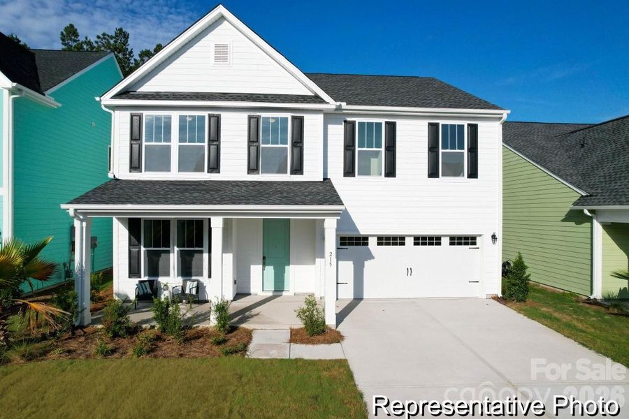 Front exterior of a new home in Whispering Hills, Locust, NC, highlighting curb appeal (Image 1). Front exterior of a new home in Whispering Hills, Locust, NC, highlighting curb appeal (Image 1).