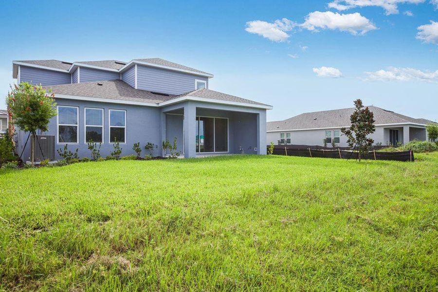 Exterior details and patio area of a home in Indigo Creek, Apollo Beach (Image 27).