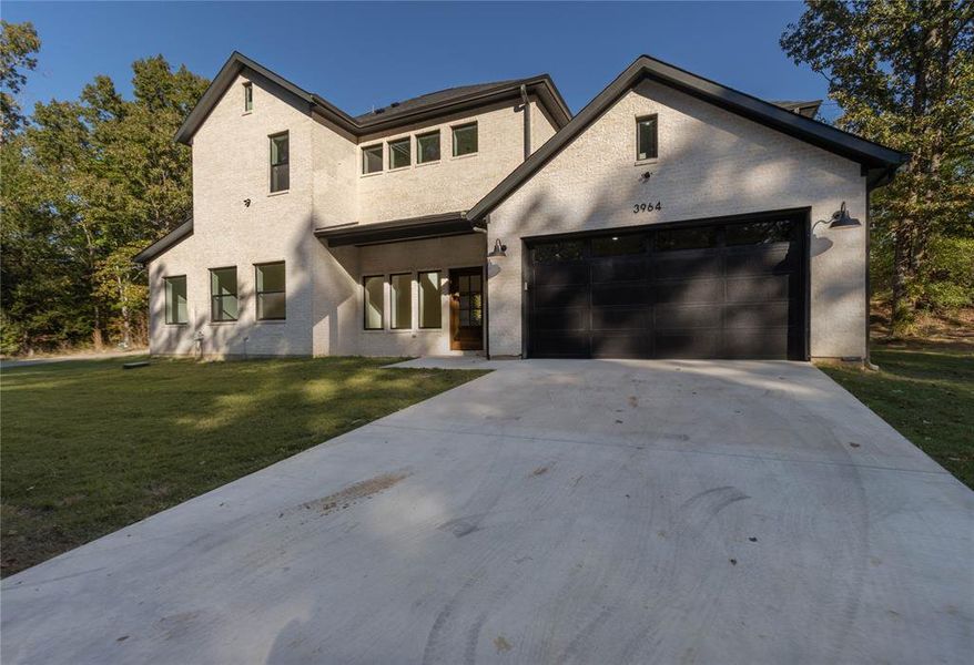 Front exterior of a new home in , Tyler, TX, highlighting curb appeal (Image 18).
