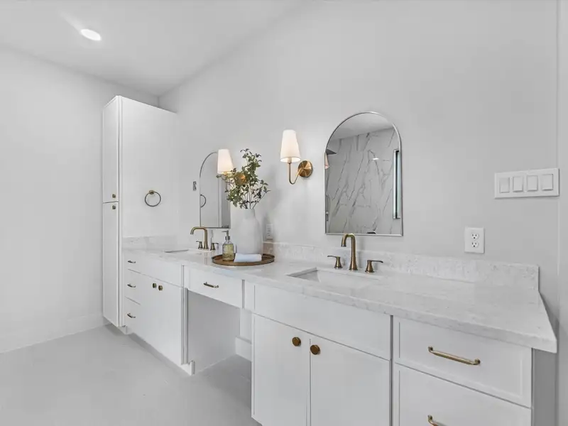 Primary bathroom details; dual sinks, extra storage space, plenty of counter space, an amazing crystal like countertop