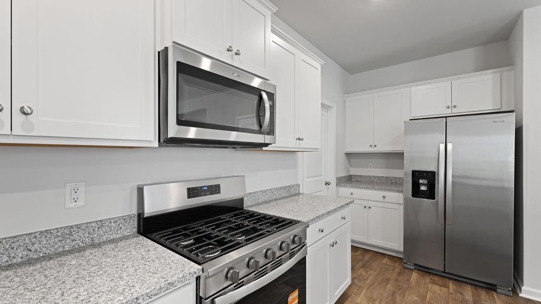 Furnished interior view inside a new home in Pine Hills at Cane Bay, Summerville (Image 7). Furnished interior view inside a new home in Pine Hills at Cane Bay, Summerville (Image 7).