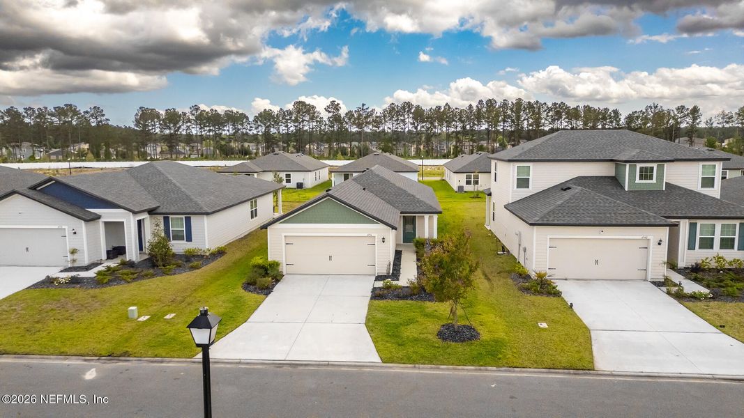 Front exterior of a new home in Westport Landing, Jacksonville, FL, highlighting curb appeal (Image 23).