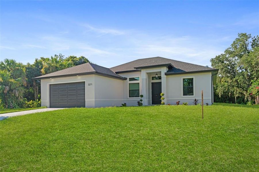 Front exterior of a new home in , North Port, FL, highlighting curb appeal (Image 21). Front exterior of a new home in , North Port, FL, highlighting curb appeal (Image 21).