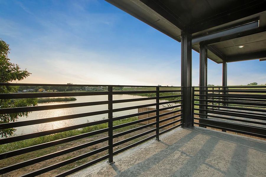 Balcony featuring a water view from the master suite